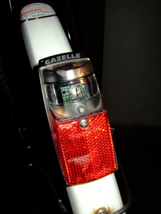 the rear lights of a bicycle in dark room