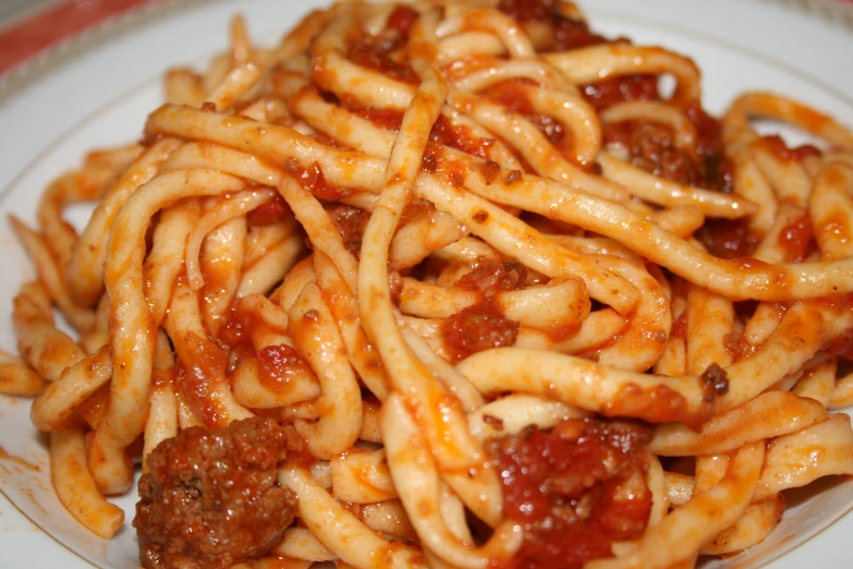 a plate full of spaghetti and meat sauce