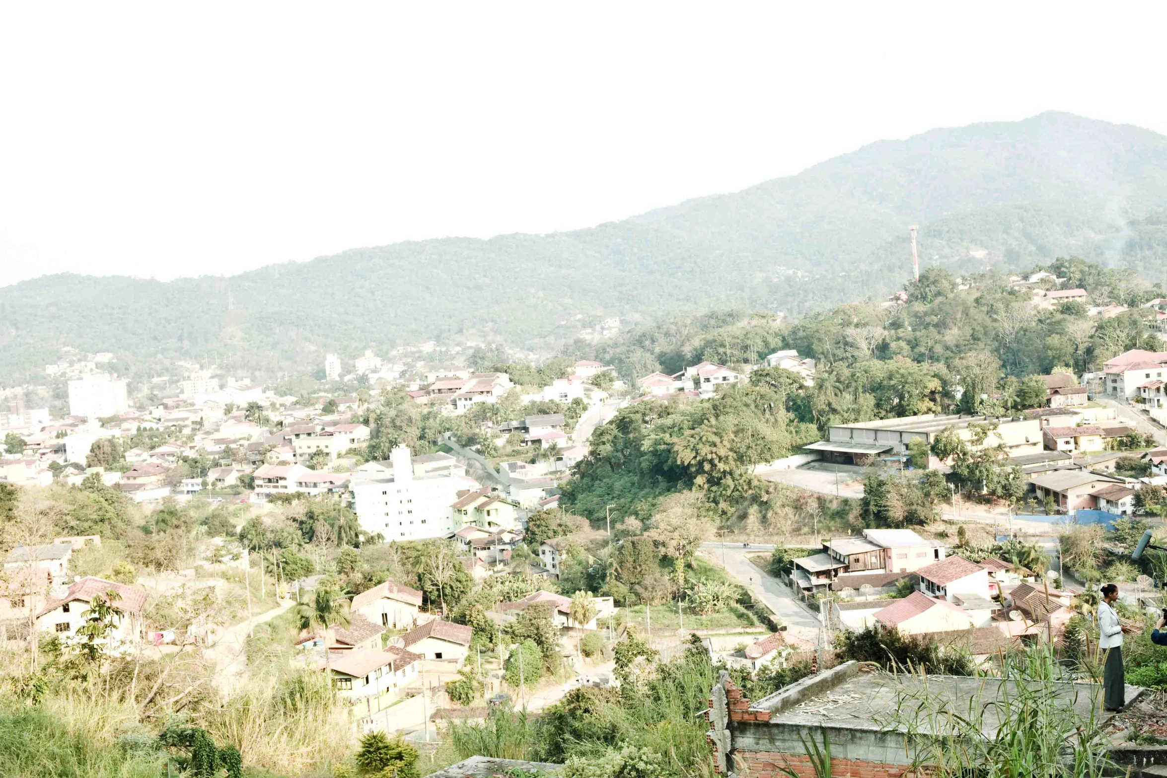 a rural village below a mountainous valley