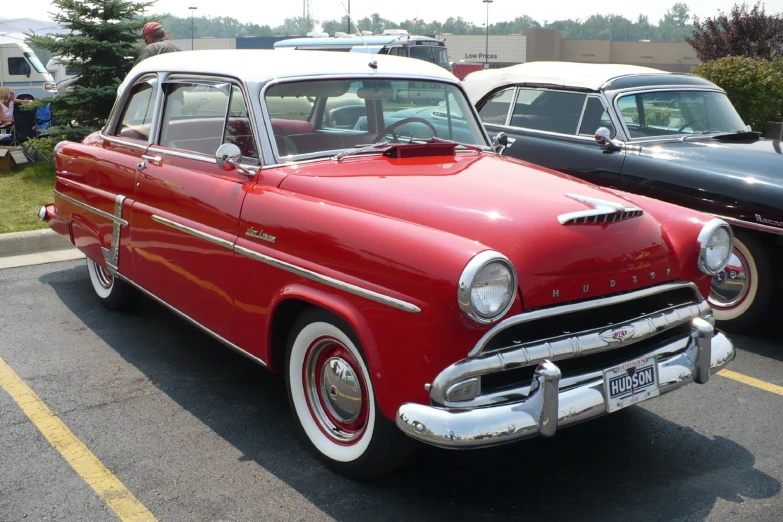 old red chevrolet cars parked in a parking lot