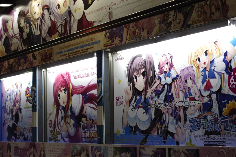 a line of anime advertises hanging on a wall
