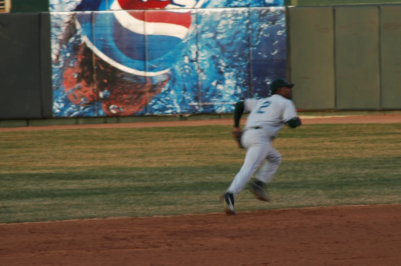 a baseball player is running on the field