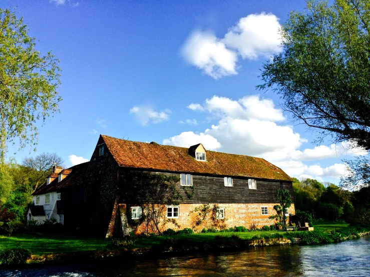 the water is running beside the large brick building