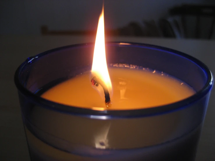 a flame burning inside of a glass container