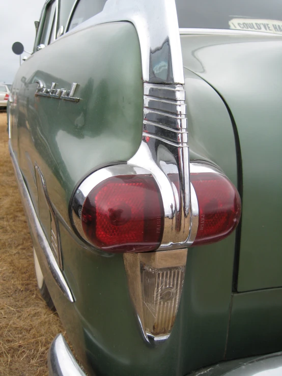 this is the taillights of an old green automobile