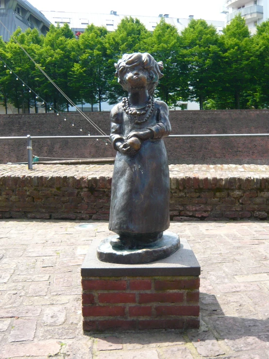 a statue of a woman that is sitting on some bricks