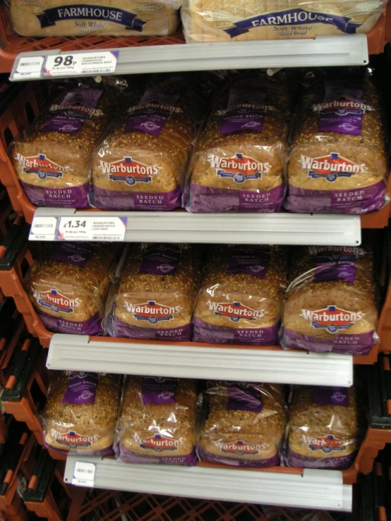 a view of several varieties of breads in a store shelf