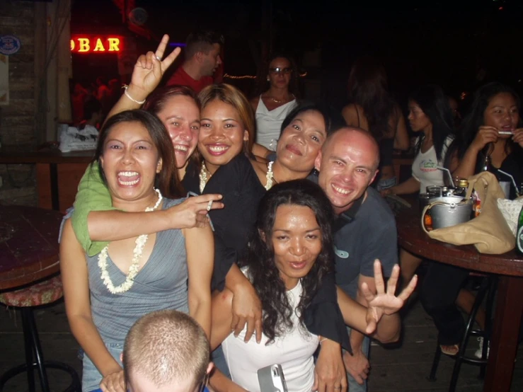 a group of people in front of a bar