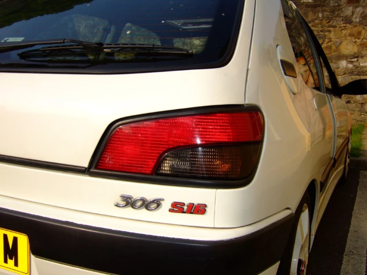 a white car with a sign on the door