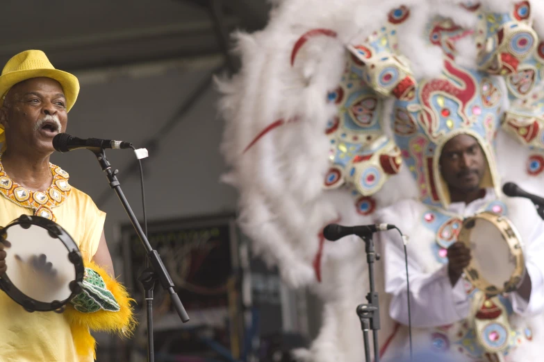 an african american performing a song at a festival