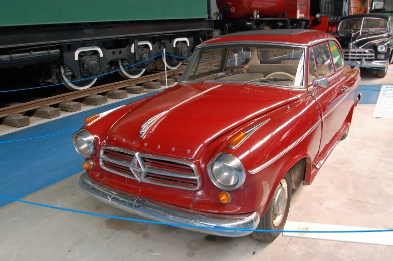 a classic car on display in a museum