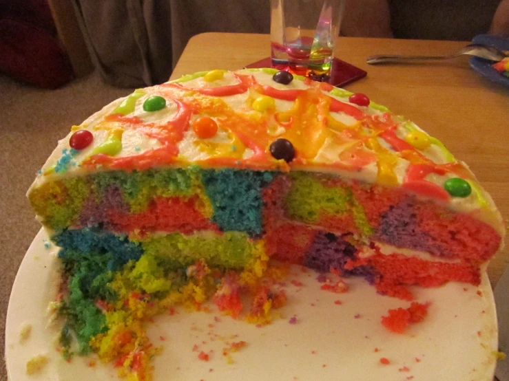 a big cake with some colorful toppings on it