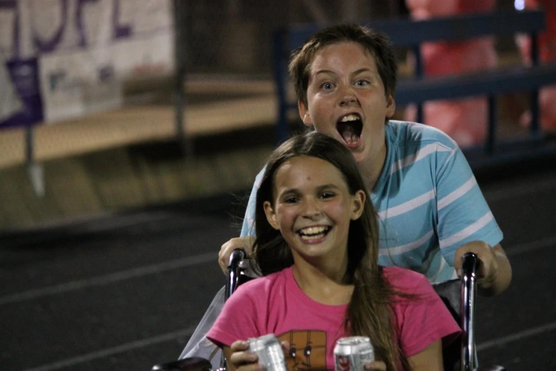 an adult with a surprised face sitting in a wheel chair