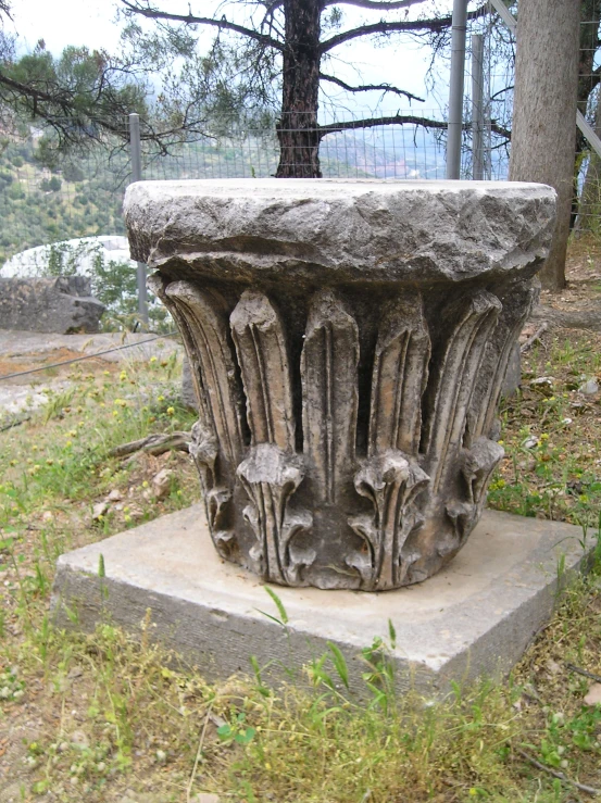 a large stone sculpture of animals resting on it