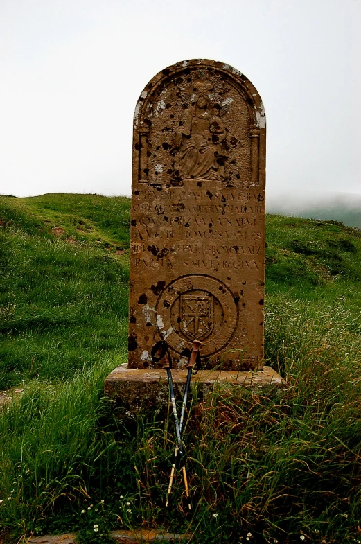 this is an old headstone in a graveyard