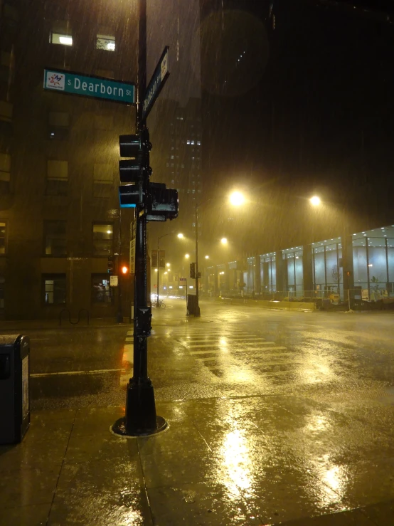 a street sign is lit up by flood lights