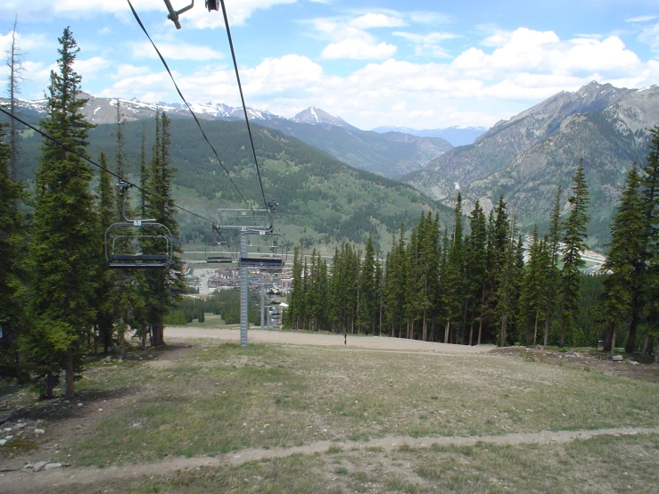 the chair lift going down the hill is empty