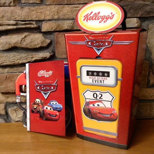 the toy refrigerator has cars on it