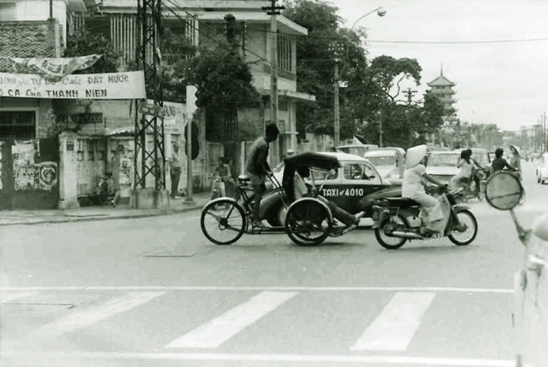 an old black and white po of people on a street