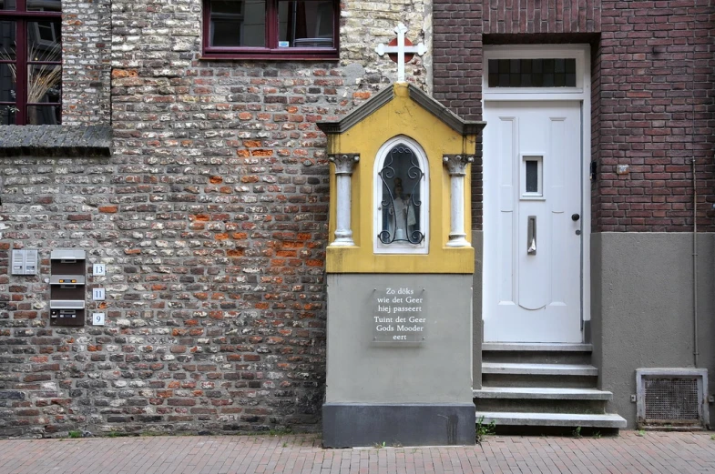 a building with a yellow front door and a black and white front door