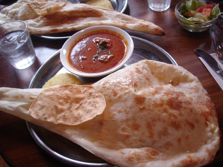 plates filled with food and two different dipping sauces