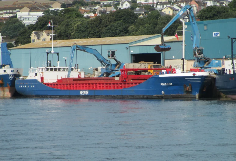 two cranes on a crane on a red boat