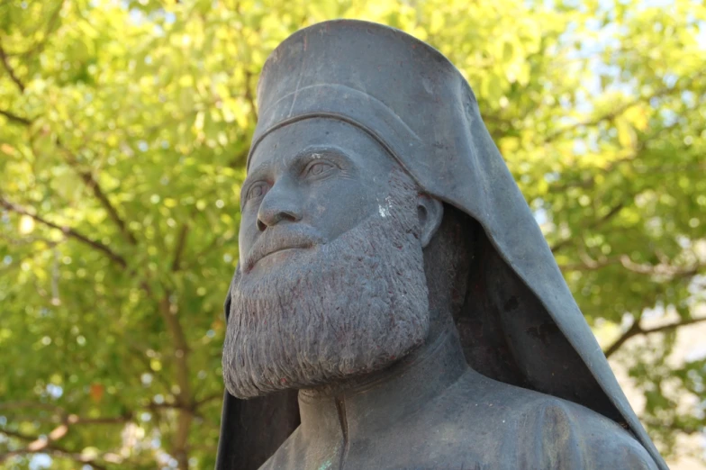 statue of a man with a beard and in a cloak