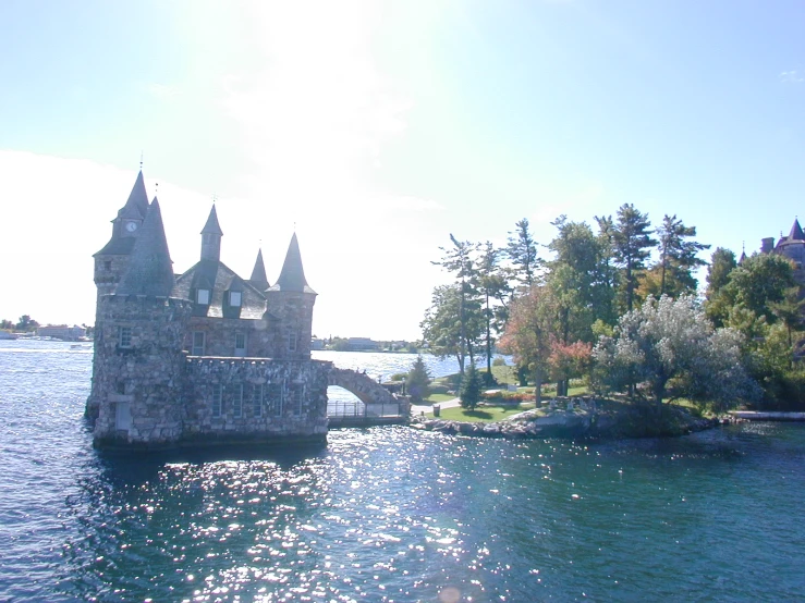 the castle overlooks a beautiful lake and shore