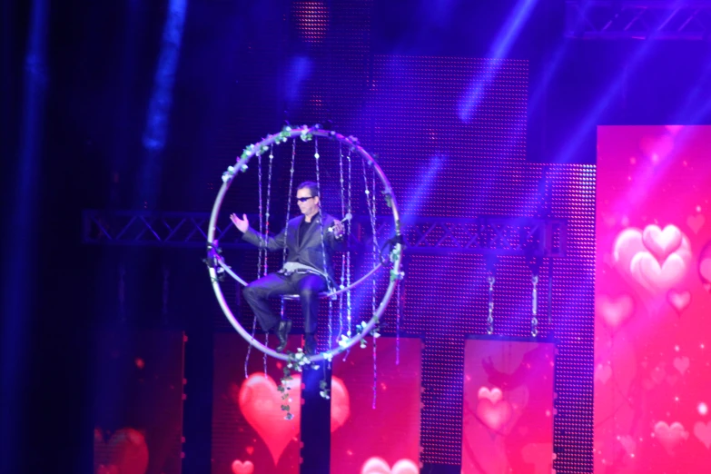 a man in a circle with lots of lights