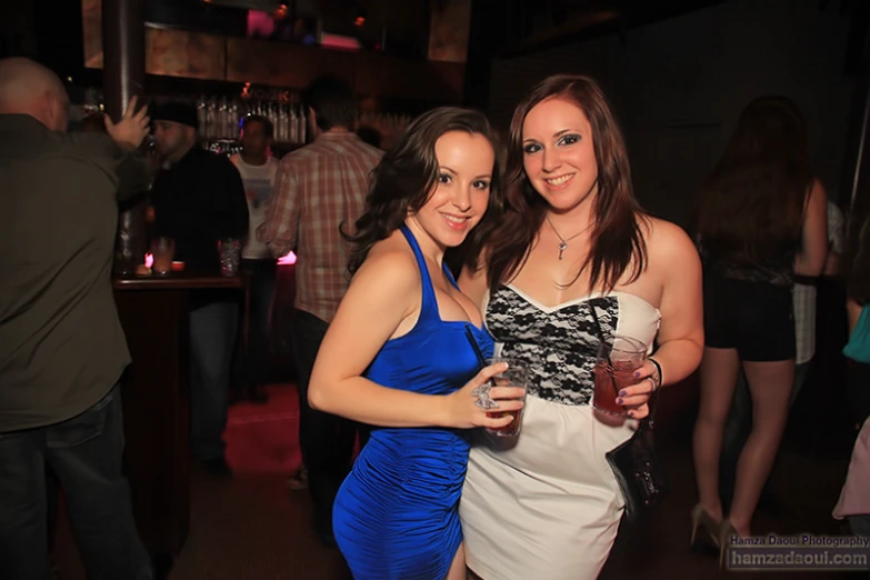 two girls at a party posing for the camera