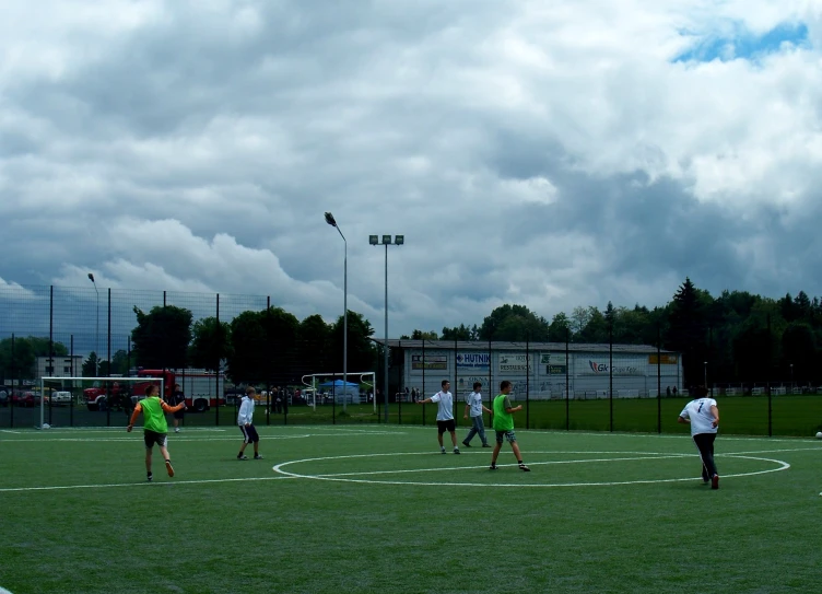 soccer players are on the field during the day