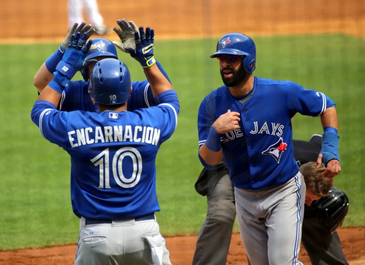 two baseball players are on the field celeting