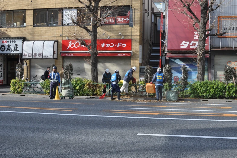 a group of people standing in the street