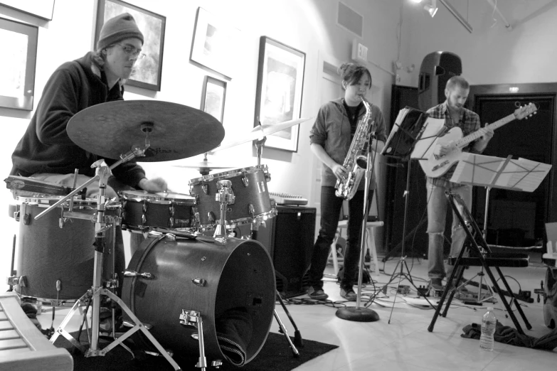 a group of people playing instruments inside of a room