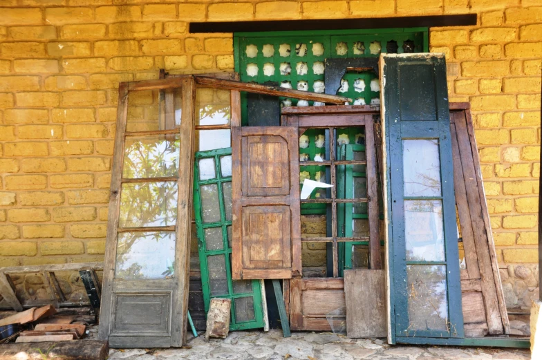doors and windows sit outside a building