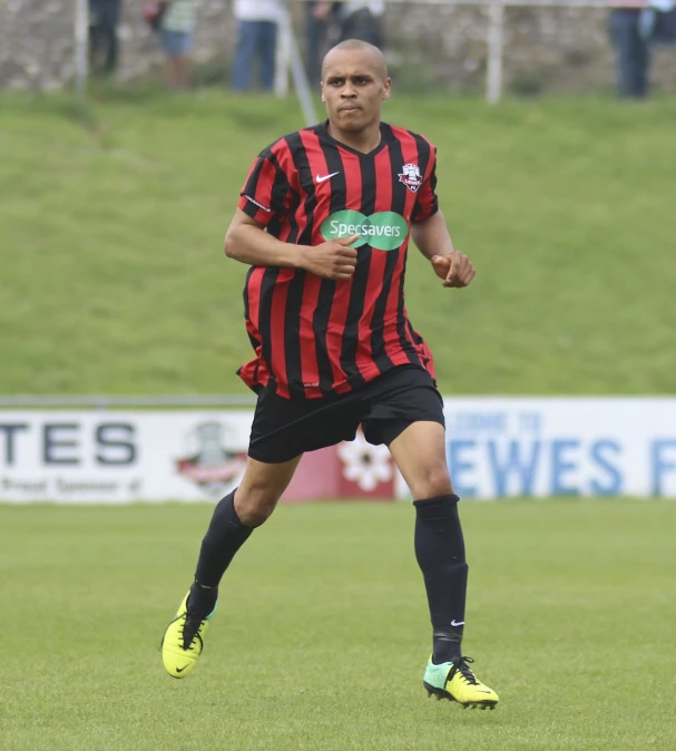 a man in a soccer field with a ball