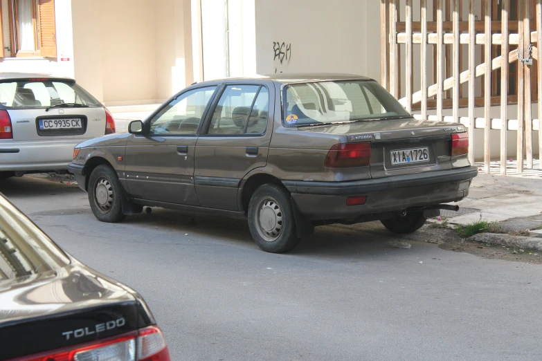 there are two cars that are stopped in the street