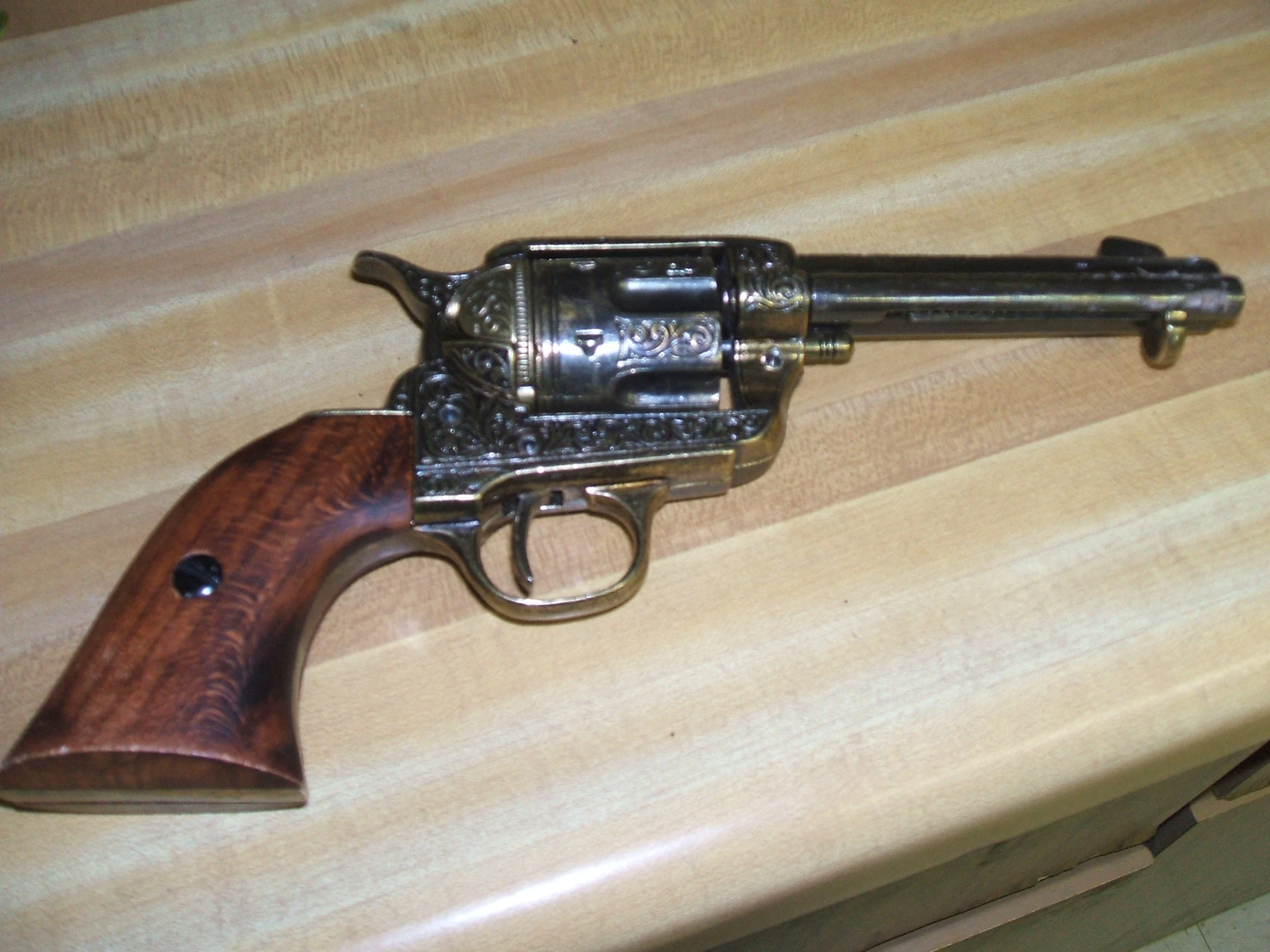 a very old gun on display on a table