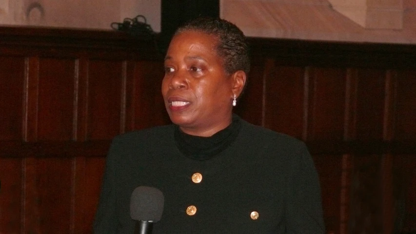 a woman standing in front of a microphone