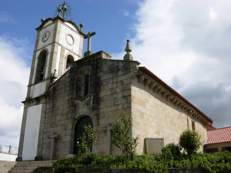 a very old church on the corner of a street