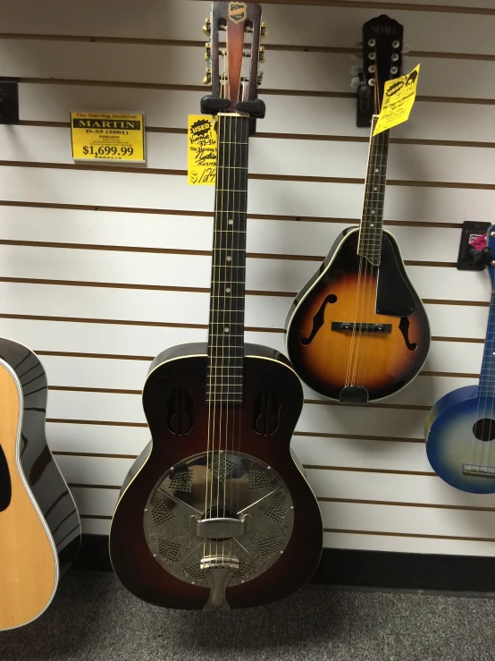 a collection of acoustic guitars are shown on display