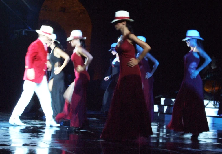 a group of people in costume walking on stage