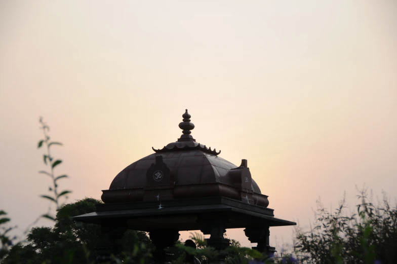 a small building with a clock built in the top