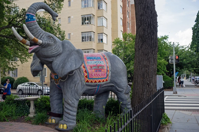 large statue of an elephant with decorative decorations on it's face