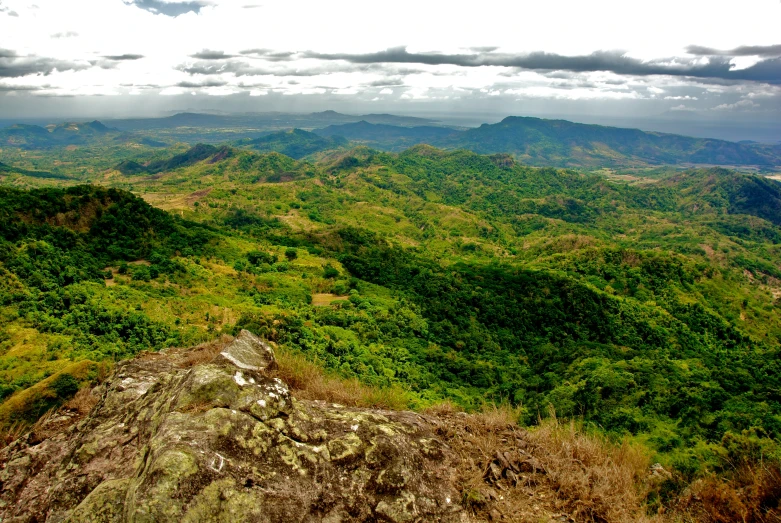 the green mountains are covered in vegetation