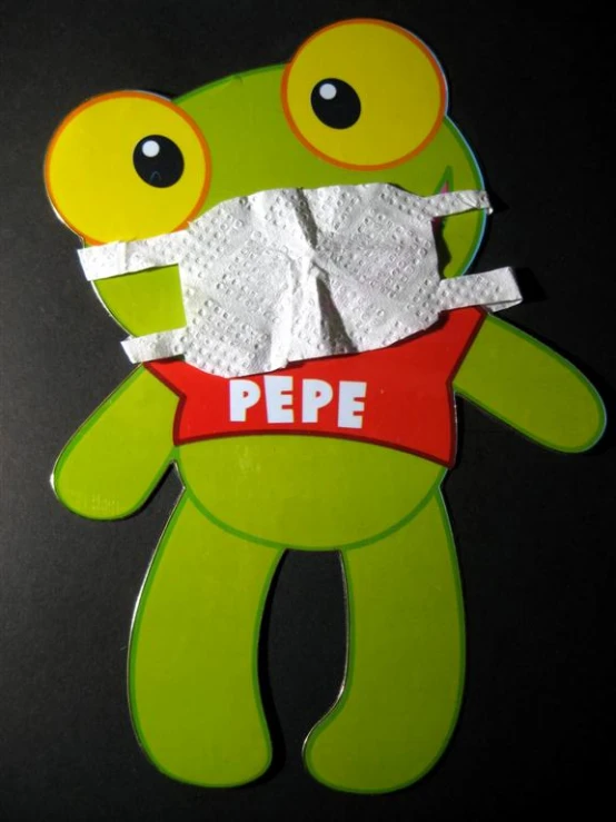 a paper cut out of a frog with bandages and eye patches