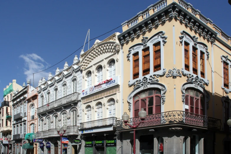 a line of buildings is shown near street signs