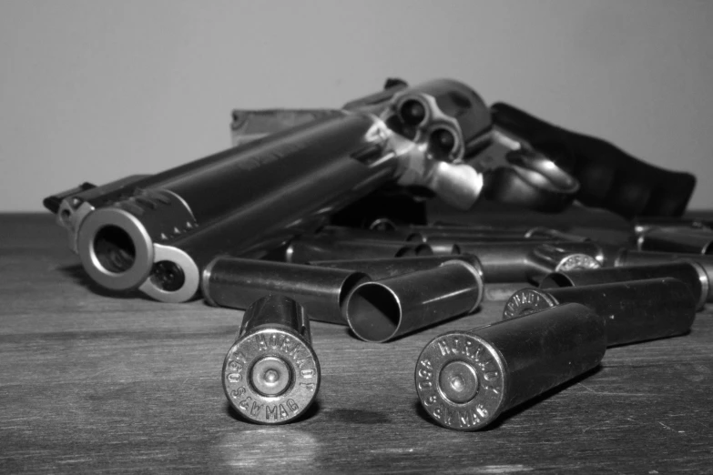 several ss of various types of revolvers sitting on a table