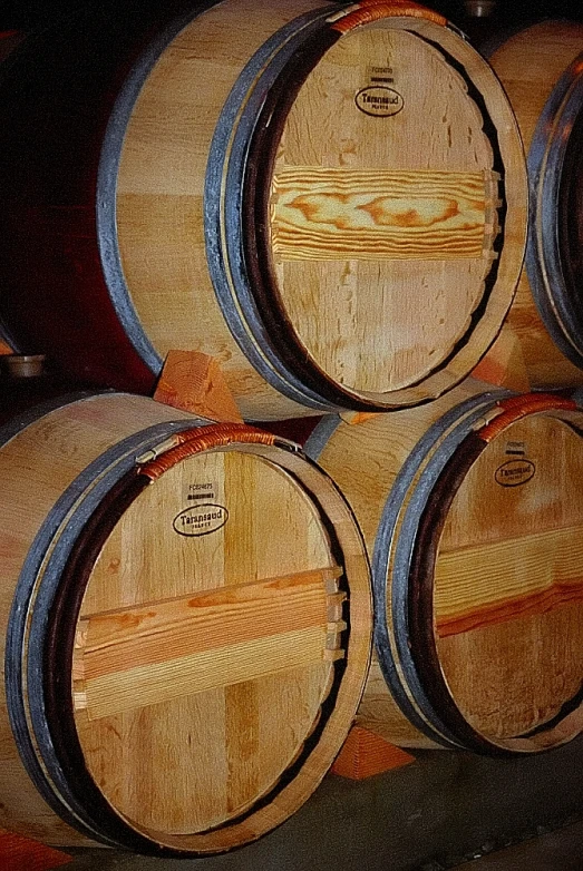 a stack of wooden barrels sitting next to each other
