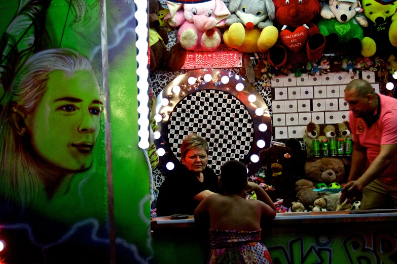 people are at a store with a display of stuffed animals